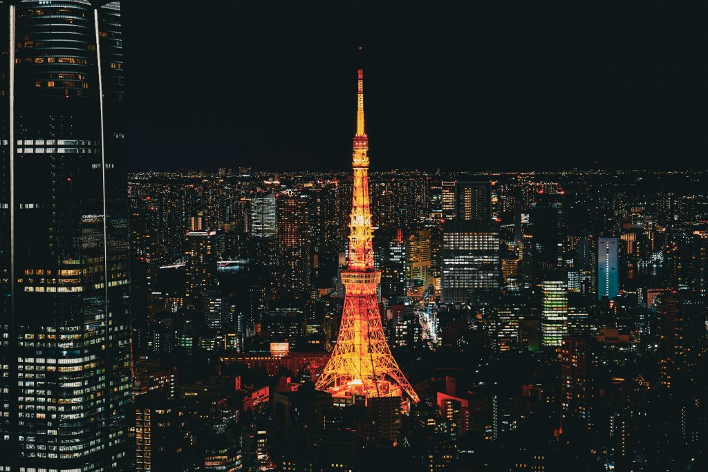 Stunning nighttime view of the Tokyo Tower glowing in the vibrant Tokyo skyline, Japan.
